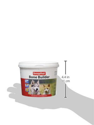 Beaphar Bone Builder dog supplement container held by a hand with measurements indicated.